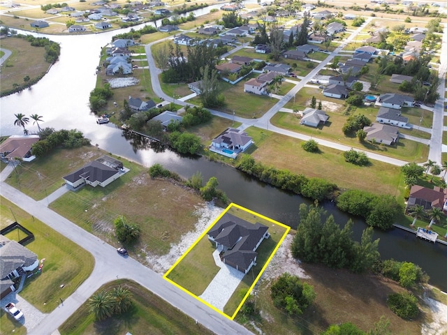 aerial view with a water view and a residential view