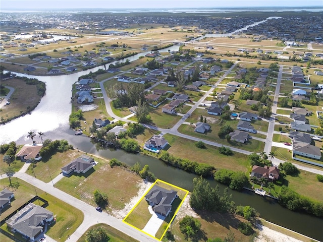 aerial view featuring a water view and a residential view