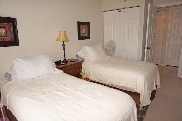 tiled bedroom featuring a closet