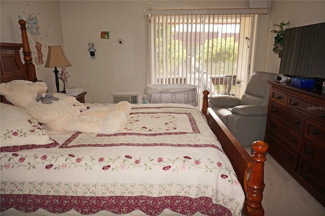 bedroom featuring access to exterior and carpet floors