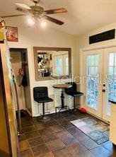 18085 Wintergarden Ave, Port Charlotte, FL 33948 - dining room featuring vaulted ceiling, french doors, and a ceiling fan