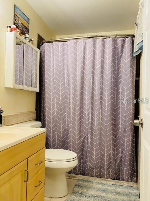 18085 Wintergarden Ave, Port Charlotte, FL 33948 - full bath featuring tile patterned flooring, vanity, and curtained shower
