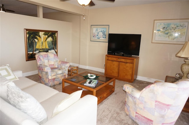 carpeted living room featuring ceiling fan