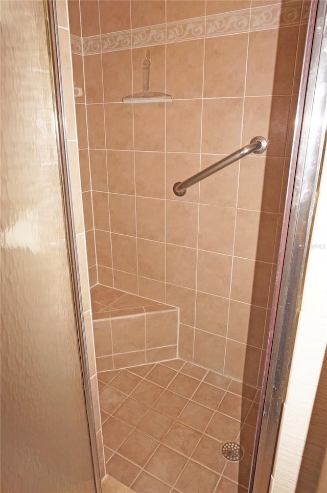 bathroom with a shower with shower door