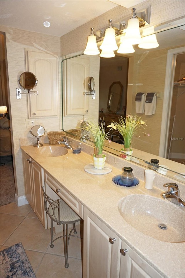 bathroom featuring tile patterned flooring and vanity