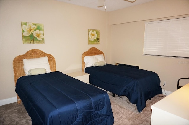 bedroom with ceiling fan and carpet