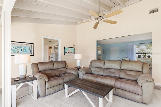 living room featuring light colored carpet, lofted ceiling with beams, and ceiling fan