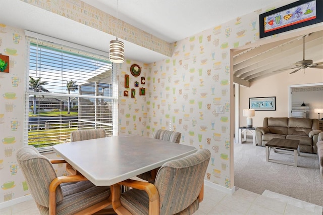 dining space featuring ceiling fan and light tile patterned floors