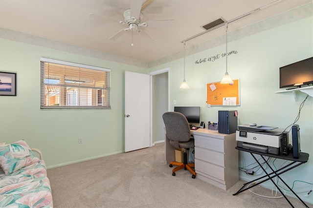 carpeted office space with ceiling fan