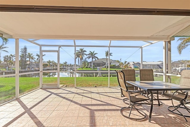 unfurnished sunroom with a water view