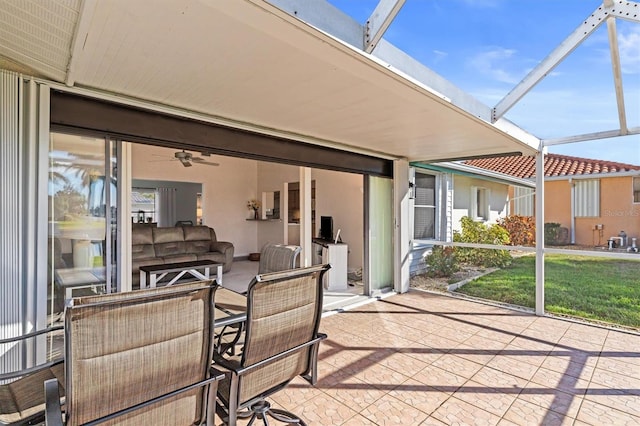 view of patio with glass enclosure