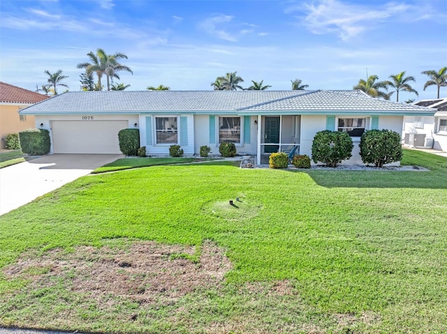 ranch-style house with a garage and a front lawn