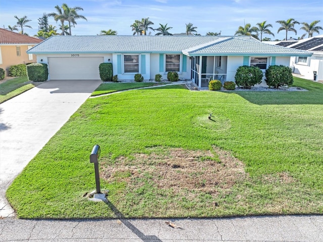 ranch-style home featuring a garage and a front lawn