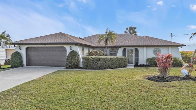 ranch-style house with a garage and a front yard