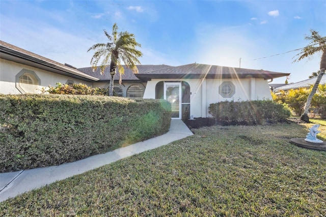 ranch-style house with a front yard