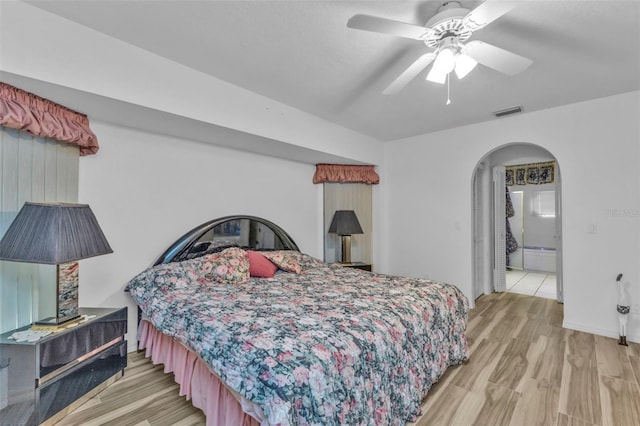 bedroom with ceiling fan and light hardwood / wood-style floors