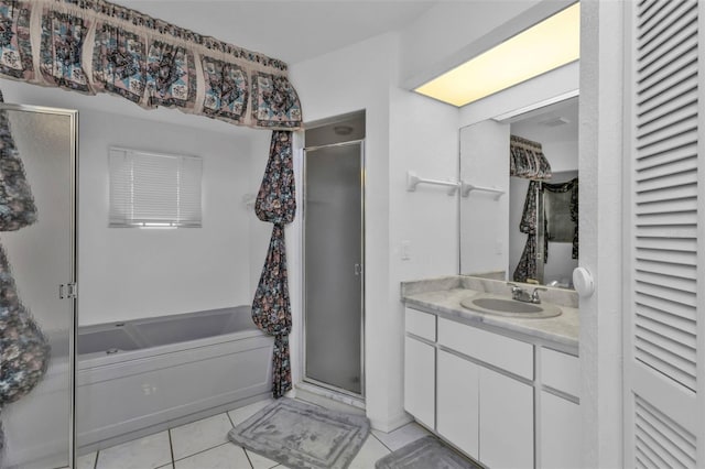 bathroom featuring vanity, tile patterned floors, and separate shower and tub