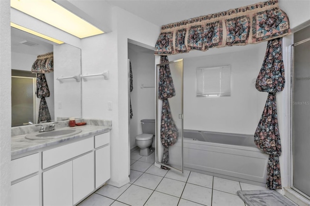 full bathroom with tile patterned flooring, vanity, plus walk in shower, and toilet