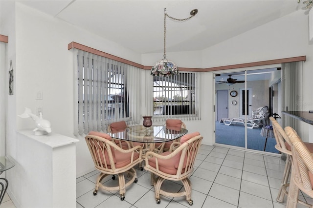 dining area with tile patterned flooring and ceiling fan