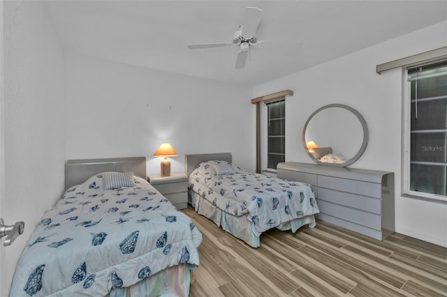 bedroom featuring light hardwood / wood-style floors and ceiling fan