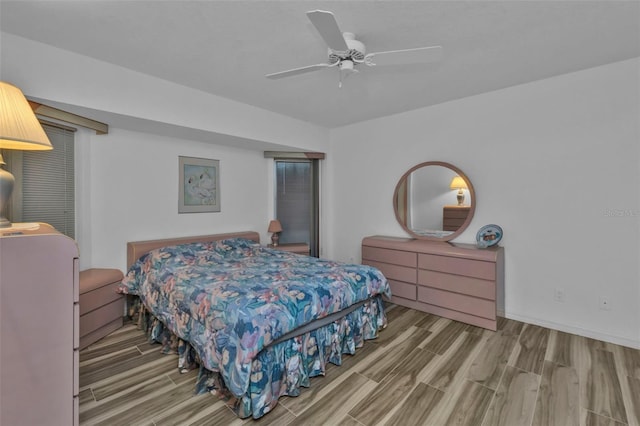 bedroom with ceiling fan and hardwood / wood-style floors