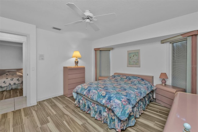 bedroom featuring ceiling fan and light wood-type flooring