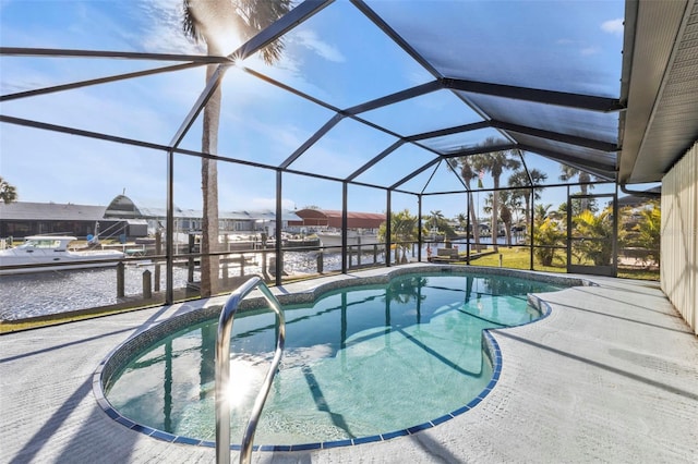 view of swimming pool with a water view, a patio, and a lanai