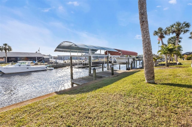 view of dock featuring a water view and a lawn