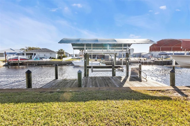 dock area featuring a water view and a yard