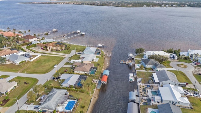 birds eye view of property featuring a water view