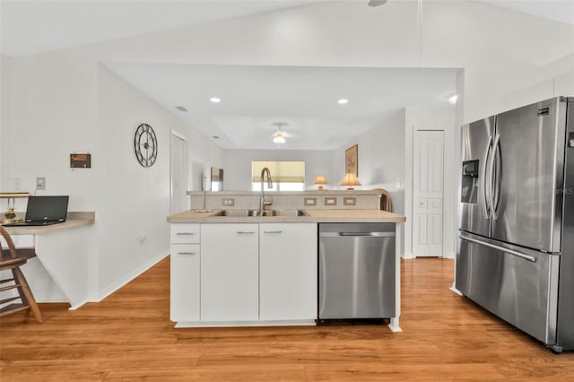 kitchen with sink, ceiling fan, stainless steel appliances, light hardwood / wood-style floors, and white cabinets