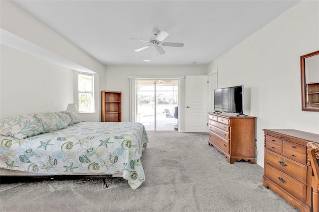 bedroom featuring light carpet, access to exterior, and ceiling fan