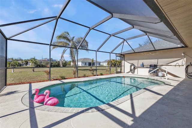 view of pool featuring a patio area and glass enclosure