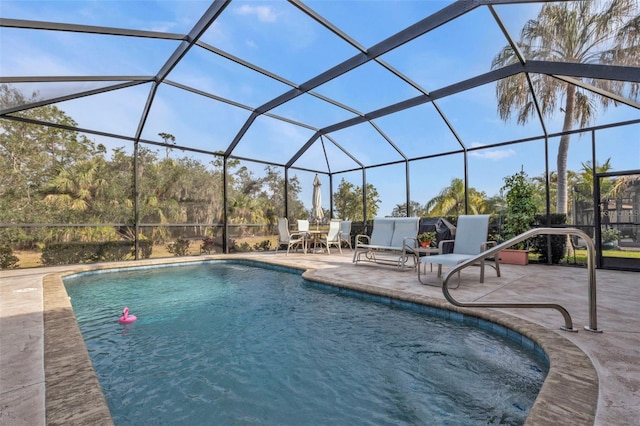 view of pool featuring a lanai and a patio