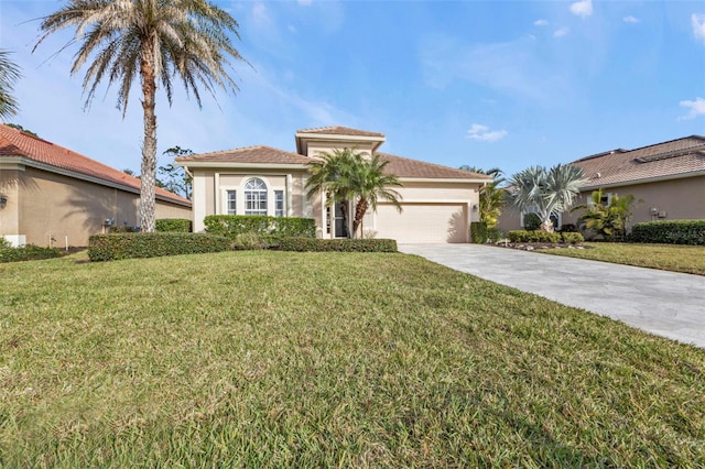 mediterranean / spanish-style home with a garage and a front lawn