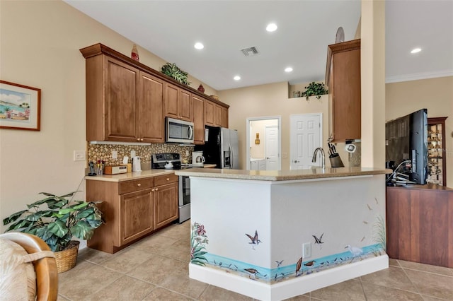 kitchen with light tile patterned floors, sink, appliances with stainless steel finishes, tasteful backsplash, and kitchen peninsula