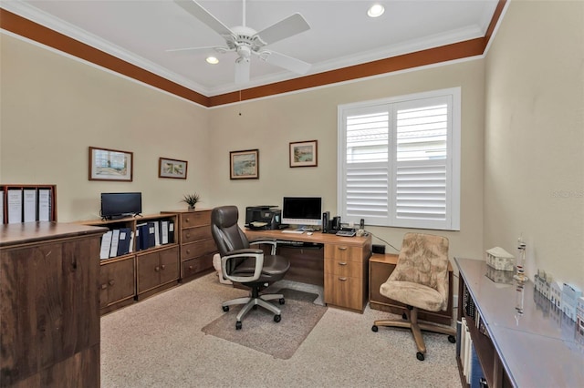 carpeted office space featuring crown molding and ceiling fan