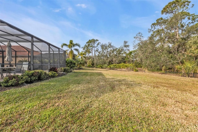 view of yard with a lanai