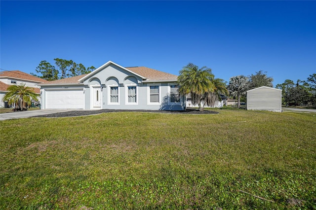 view of front of property featuring a garage and a front yard