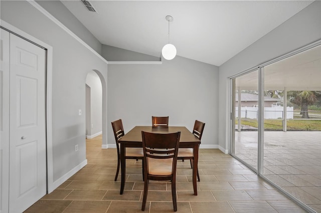 dining space with lofted ceiling