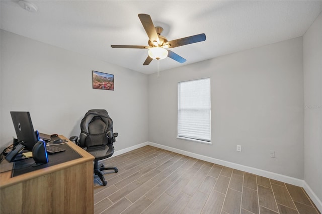 unfurnished office featuring wood-type flooring and ceiling fan