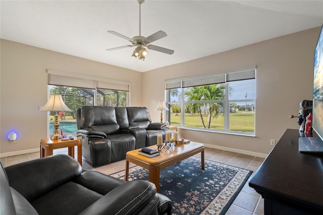 living room featuring light tile patterned floors and ceiling fan