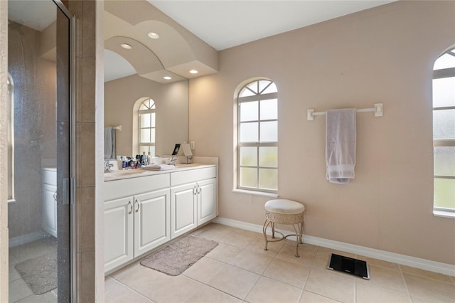 bathroom featuring a shower, tile patterned floors, vanity, and plenty of natural light