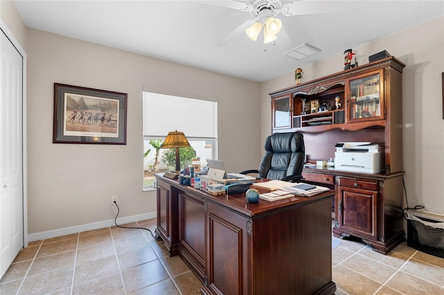 office featuring light tile patterned floors and ceiling fan