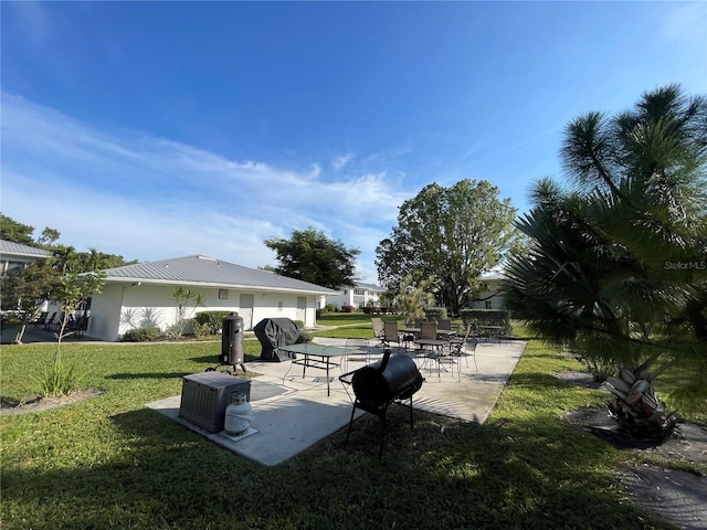 exterior space with a yard and a patio area