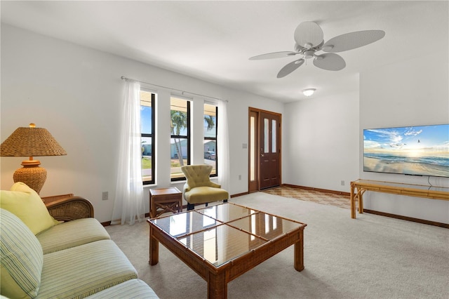 living room featuring light colored carpet and ceiling fan