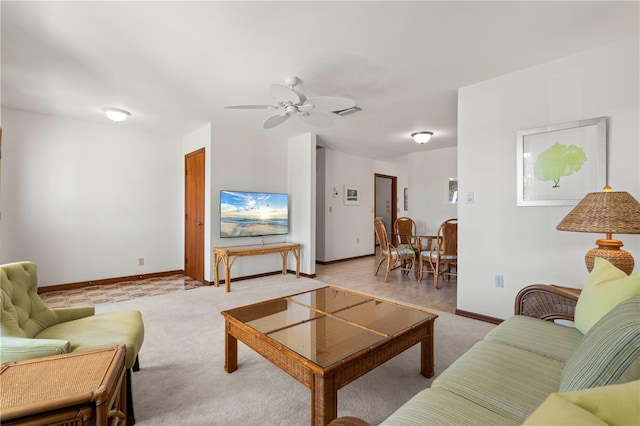 carpeted living room featuring ceiling fan