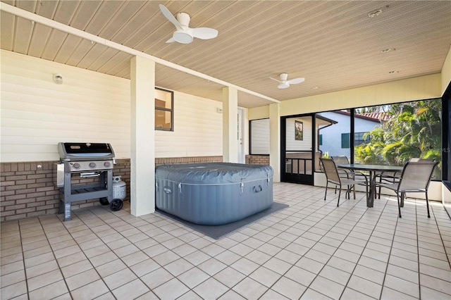 view of patio / terrace with a hot tub, area for grilling, and ceiling fan