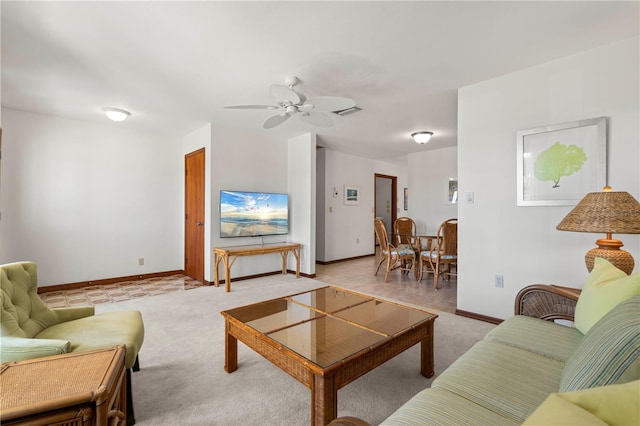 520 Boardman Dr, Punta Gorda, FL 33950 - living room featuring light colored carpet, baseboards, a ceiling fan, and visible vents