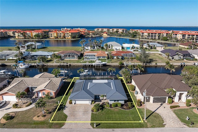 birds eye view of property featuring a water view